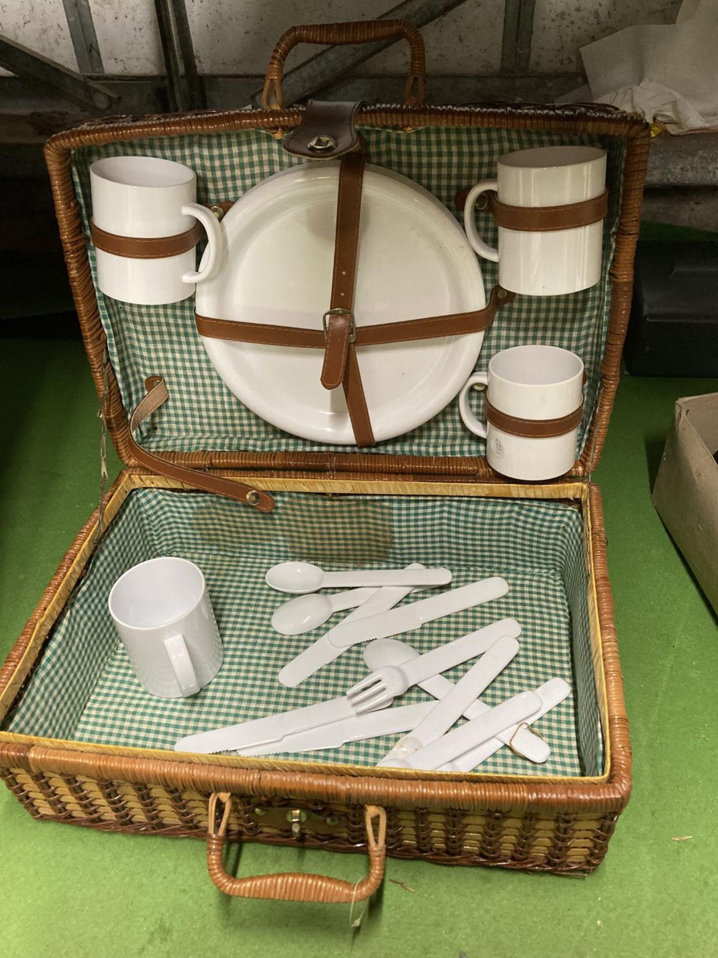 A PICNIC BASKET WITH CONTENTS
