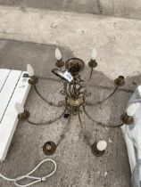 A BRASS EFFECT EIGHT BRANCH CEILING LIGHT FITTING