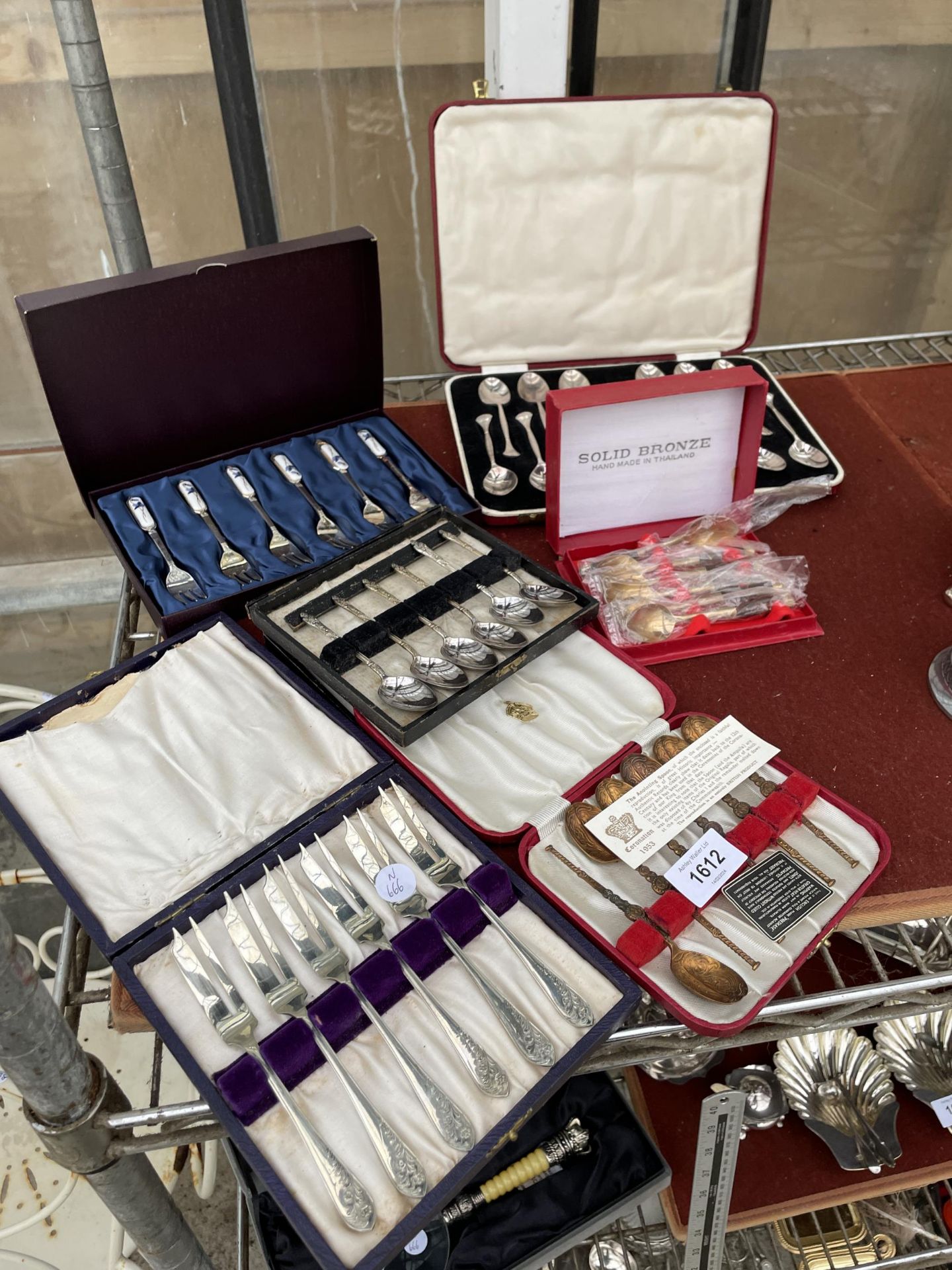 SIX COMPLETE SETS OF CASED FLATWARE TO INCLUDE ANOINTING SPOONS, TEASPOONS AND CAKE FORKS ETC