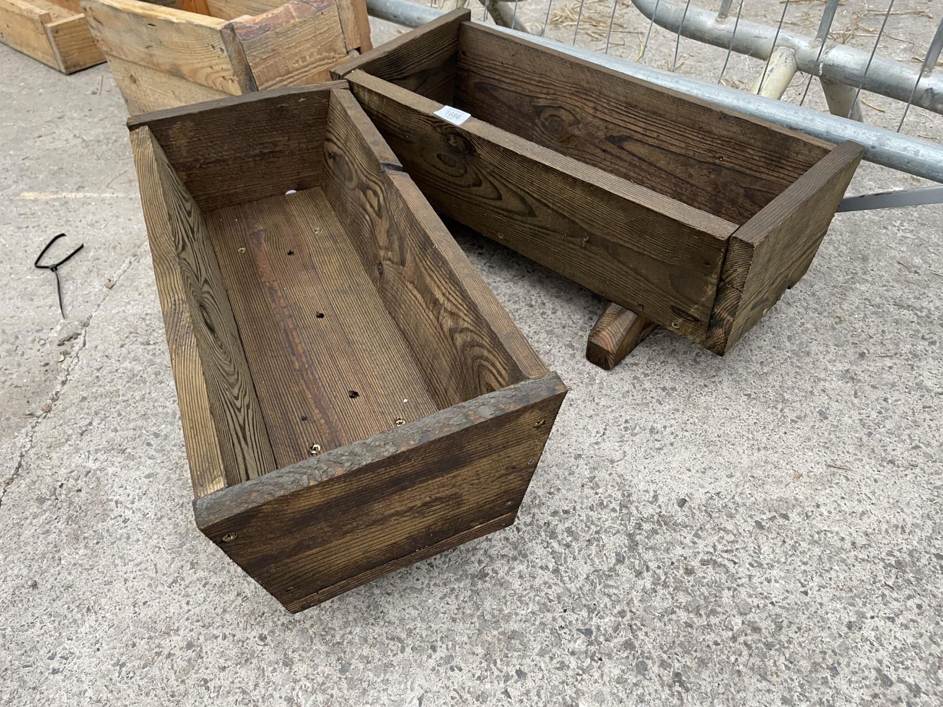 TWO SMALL WOODEN TROUGH PLANTERS