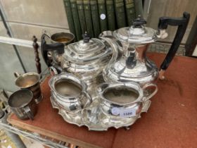 AN ASSORTMENT OF SILVER PLATED ITEMS TO INCLUDE A TRAY AND A VINERS TEASET COMPRISING OF A TEAPOT,