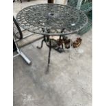 A ROUND ALLOY BISTRO TABLE