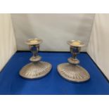 A PAIR OF HEAVY ART DECO STYLE SILVER PLATED CANDLESTICKS