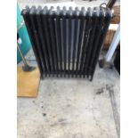 A VINTAGE HEAVY CAST IRON RADIATOR