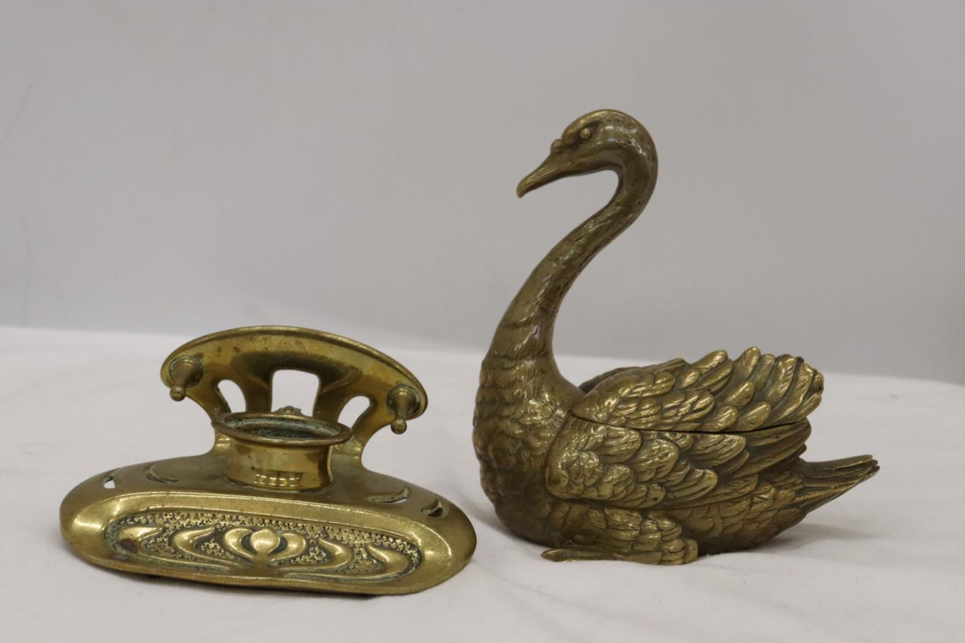 TWO VINTAGE GERMAN 'GESCHUTZT' BRASS INKWELLS, ONE IN THE SHAPE OF A SWAN