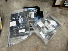 AN ASSORTMENT OF PROGRAMMES AND BROCHURES TO INCLUDE MICHAEL JACKSON AND LADY GAGA ETC