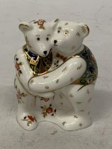 A ROYAL CROWN DERBY PAIR OF BEARS HUGGING