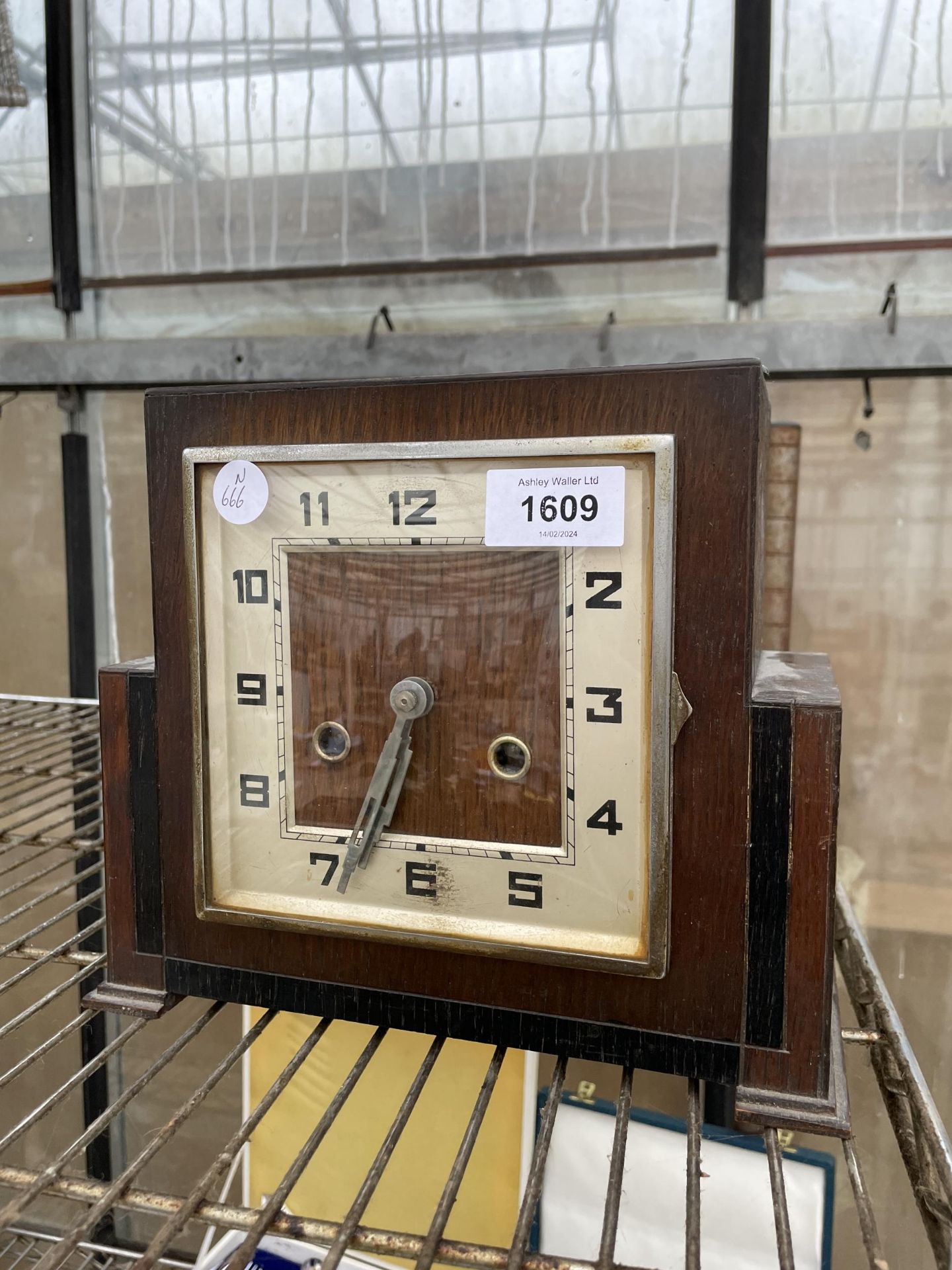 AN OAK CASED ART DECO CHIMING MANTLE CLOCK