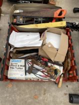 AN ASSORTMENT OF TOOLS TO INCLUDE A TILE CUTTER, SAWS AND RASPS ETC