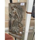 A BRONZED ON CHALK PLAQUE OF A CLASSICAL GREEK GODDESS