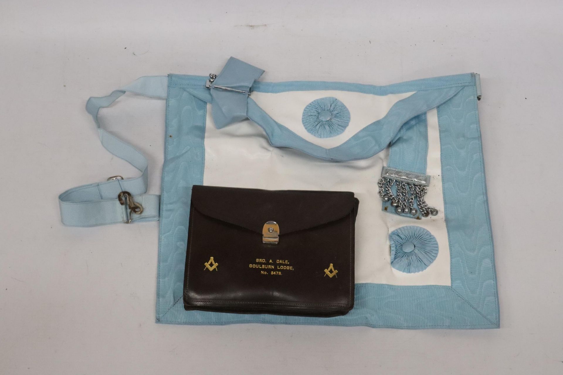 A MASONIMC APRON IN A LEATHER POUCH BELONGED TO BRO. A. DALE, GOULBURN LODGE, NO. 8478