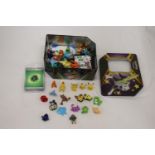 A TIN FULL OF POKEMON, TOYS, STICKERS AND CHARMS