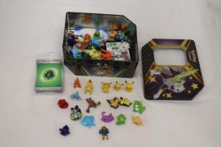 A TIN FULL OF POKEMON, TOYS, STICKERS AND CHARMS