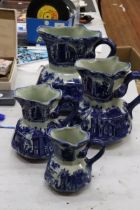 FOUR MATCHING, GRADUATING BLUE AND WHITE IRONSTONE JUGS, LARGEST HEIGHT 23CM