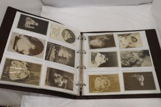 AN ALBUM CONTAINING A COLLECTION OF SEPIA VICTORIAN PHOTOGRAPHS