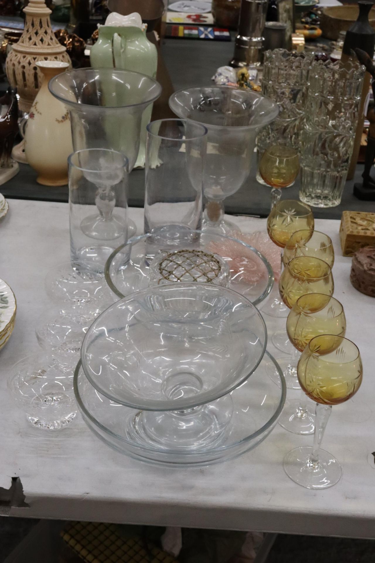 A QUANTITY OF GLASSWARE TO IJCLUDE BOWLS, VASES, DISHES, GLASSES, ETC.,