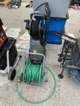 A HOSE REEL AND A KARCHER XPERT HD PRESSURE WASHER