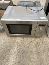 A SILVER BOSCH MICROWAVE OVEN