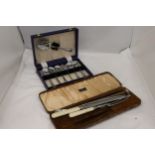 TWO VINTAGE BOXED SETS OF FLATWARE TO INCLUDE DESSERT SPOONS AND A CARVING SET