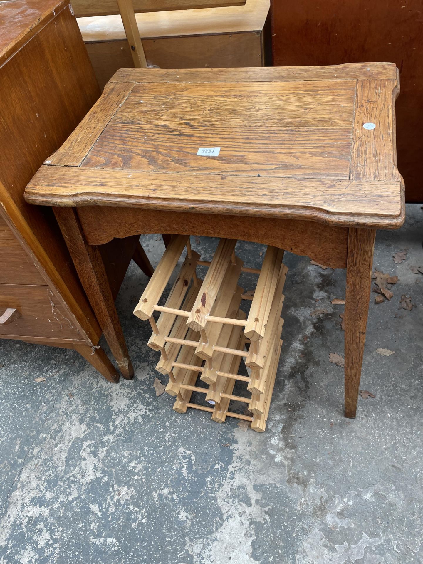 AN OAK OCCASIONAL TABLE AND AN EIGHT BOTTLE WINE RACK