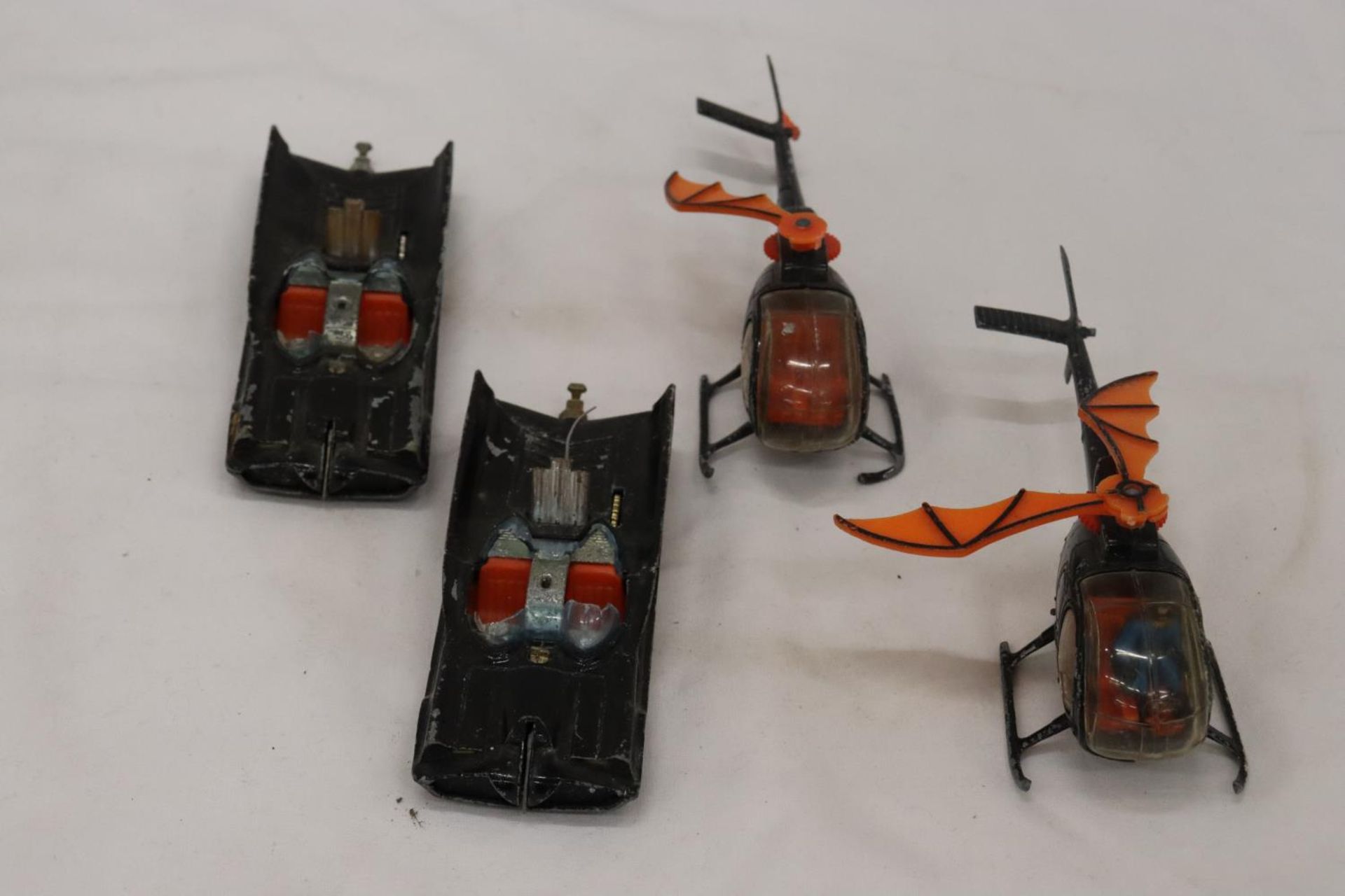 TWO CORGI BATMOBILES TOGETHER WITH TWO BATCOPTERS