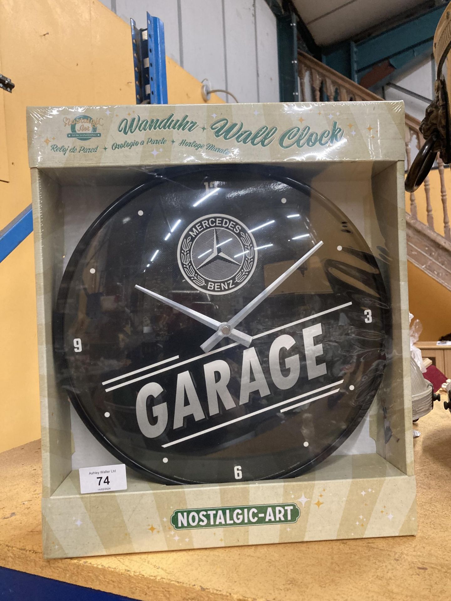AN AS NEW AND BOXED MERCEDES BENZ GARAGE WALL CLOCK