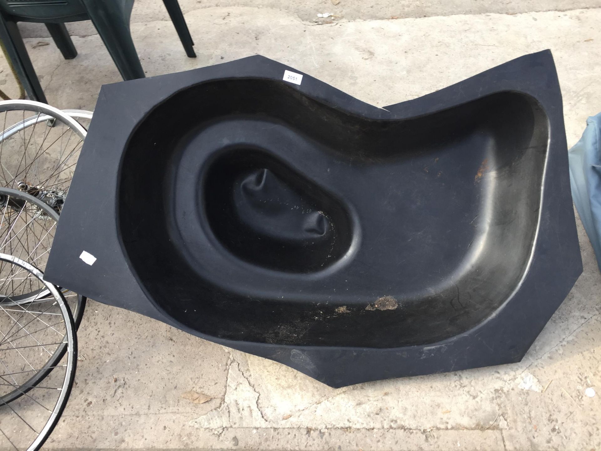 A PLASTIC WATER FEATURE/ POND LINER