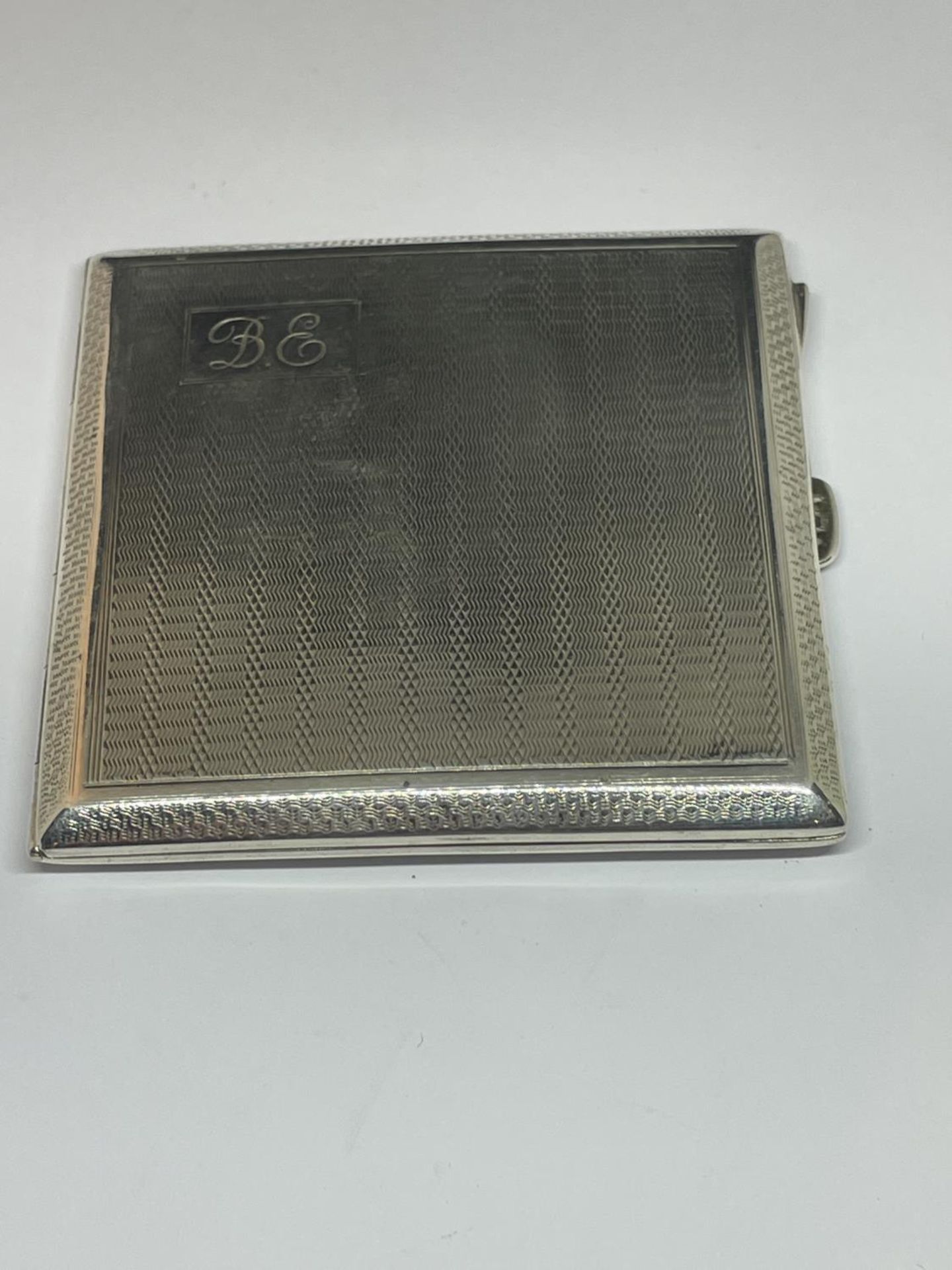 A HALLMARKED BIRMINGHAM SILVER CIGARETTE CASE ENGRAVED