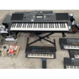 TWO ELECTRIC KEYBOARDS TO INCLUDE A YAMAHA WITH STAND