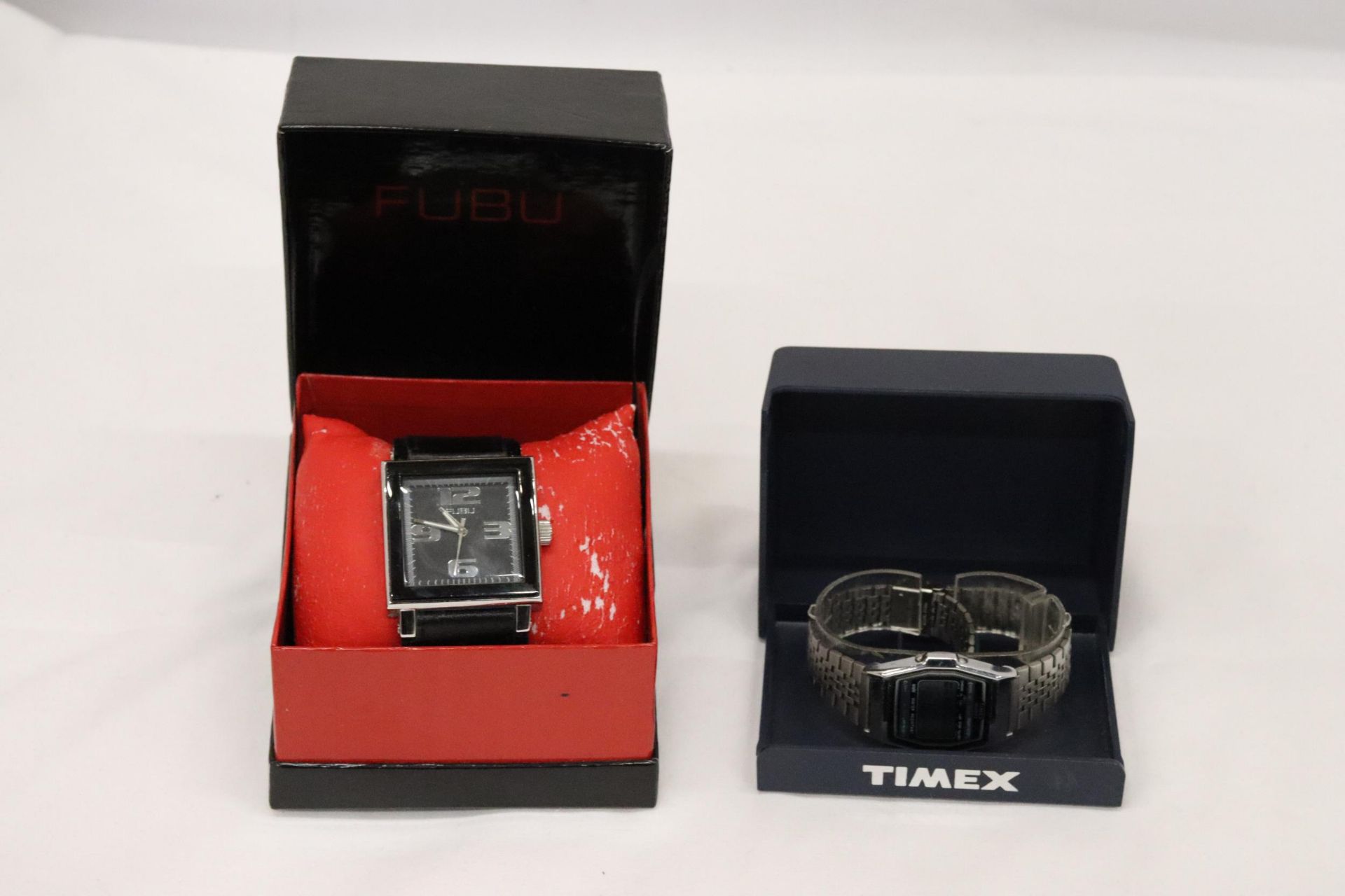 TWO WATCHES TO INCLUDE A TIMEX DIGITAL AND FUBU BOTH WORKING AT TIME OF CATALOGING NO WARRANTY GIVEN