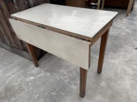 A 1950s SINGLE DROP LEAF FORMICA TOPPED KITCHEN TABLE