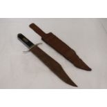 A LARGE VINTAGE DAGEE IN LEATHER SHEATH