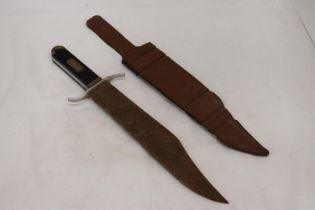 A LARGE VINTAGE DAGEE IN LEATHER SHEATH