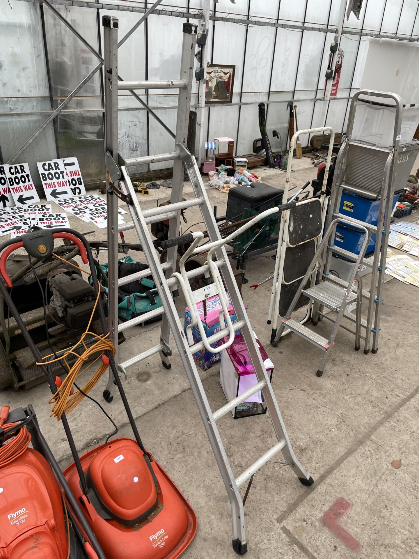 A MULTIFOLDING ALUMINIUM LADDER WITH ROOF ATTATCHMENT