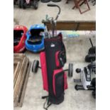 A GOLF BAG, A GOLF TROLLEY AND AN ASSORTMENT OF GOLF CLUBS