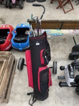 A GOLF BAG, A GOLF TROLLEY AND AN ASSORTMENT OF GOLF CLUBS