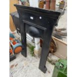 A SMALL METAL FIRE SURROUND