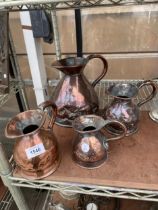 A COLLECTION OF FOUR GRADUATED VINTAGE COPPER MEASURING JUGS