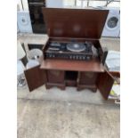 A WOODEN STEREO CABINET WITH SPEAKERS AND A GARRARD RECORD DECK