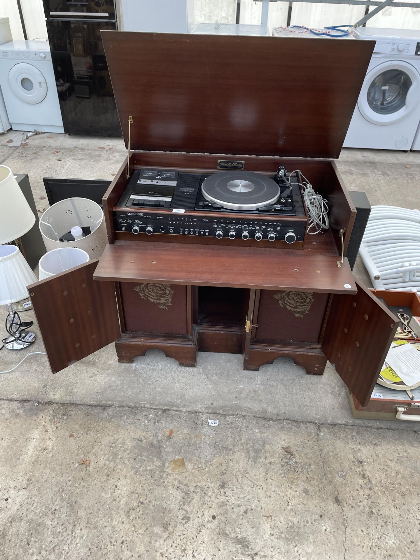 A WOODEN STEREO CABINET WITH SPEAKERS AND A GARRARD RECORD DECK