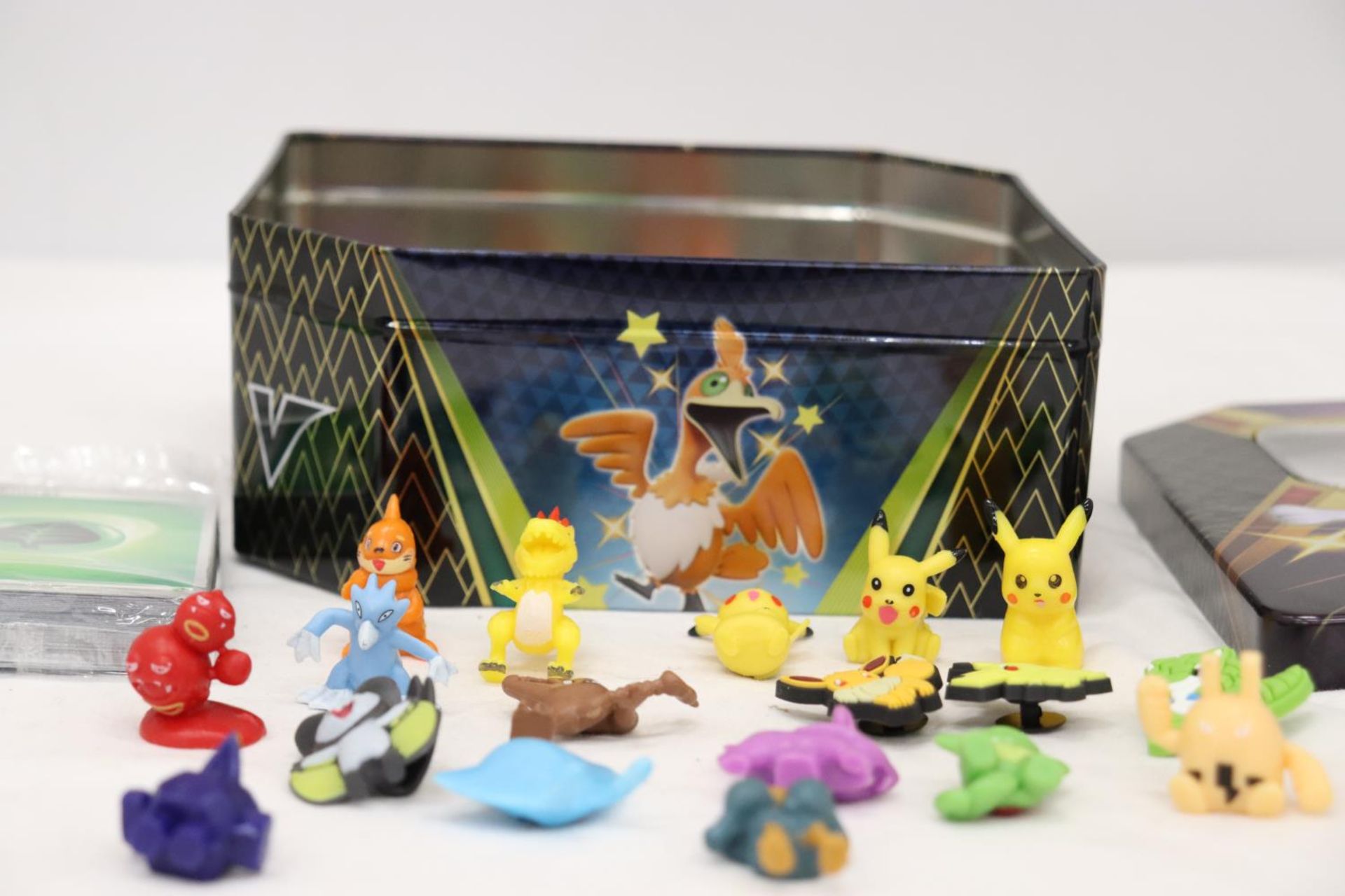 A TIN FULL OF POKEMON, TOYS, STICKERS AND CHARMS - Image 5 of 5