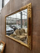 A 19TH CENTURY STYLE GILT FRAMED WALL MIRROR 35"X27" HAVING LABEL TO BACK BESTELNUMMER NO.2121-192