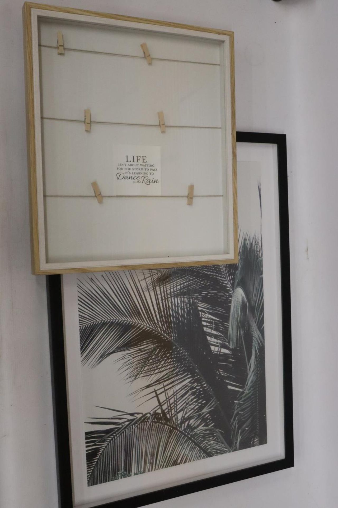 A FRAMED PRINT OF FOLIAGE PLUS A FRAMED MOTTO 'LIFE ISN'T ABOUT WAITING FOR THE STORM TO PASS, IT'