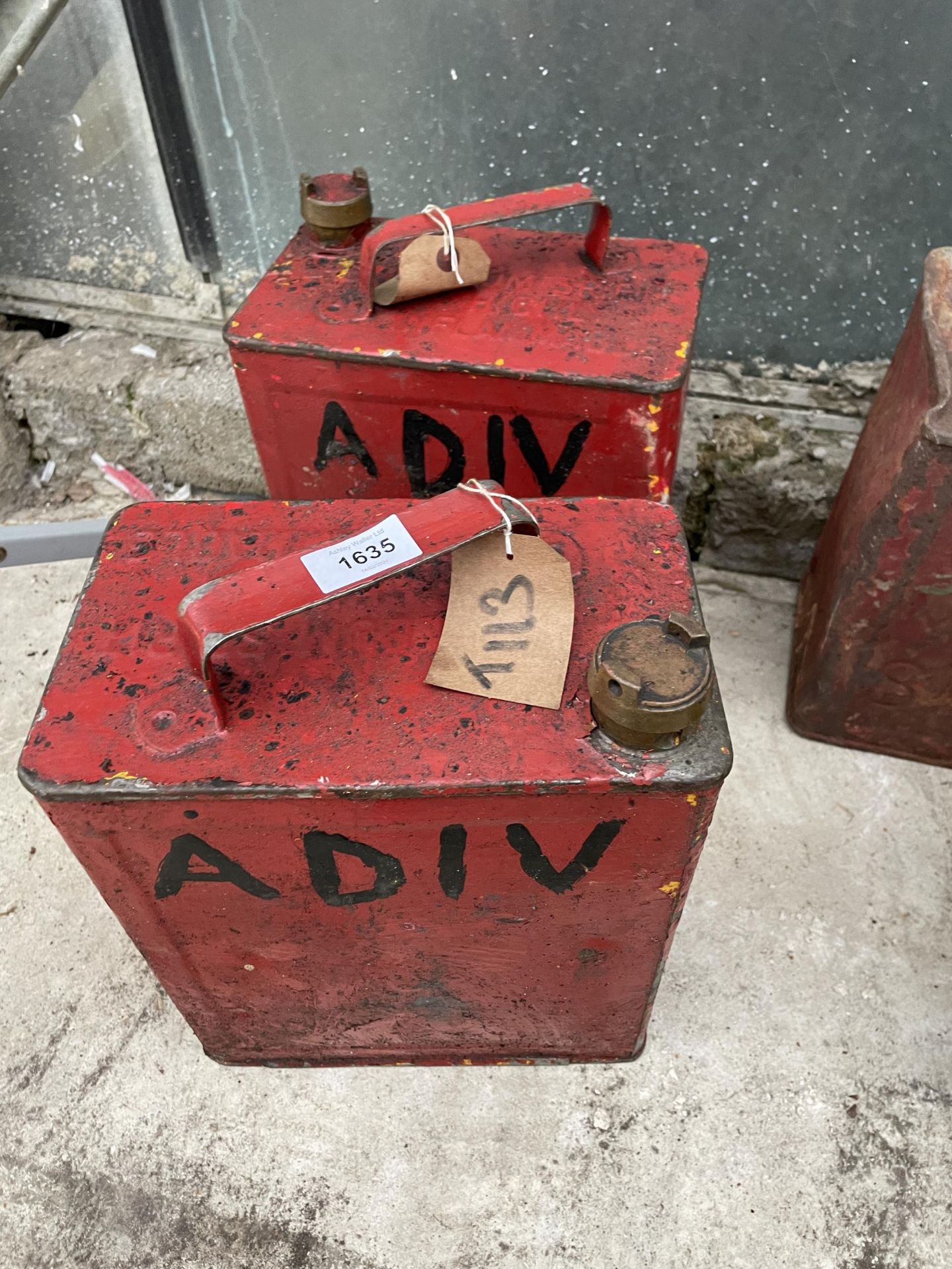 TWO VINTAGE FUEL CANS WITH BRASS CAPS