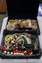 A LARGE QUANTITY OF COSTUME JEWELLERY TO INCLUDE AMBER STYLE BEADS, BANGLES, NECKLACES, BEADS,