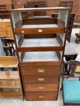 A MAHOGANY CENTRAL WARDROBE SECTION ENCLOSING FOUR DRAWERS AND THREE SLIDES, 24.5" WIDE