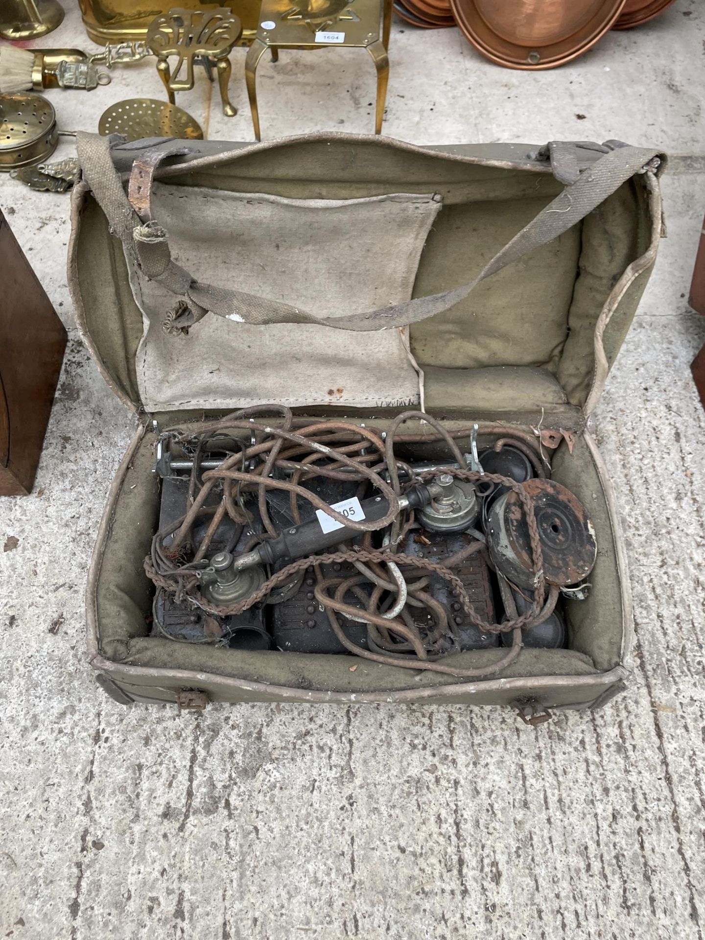 A VINTAGE MILITARY FIELD TELEPHONE WITH CARRY CASE