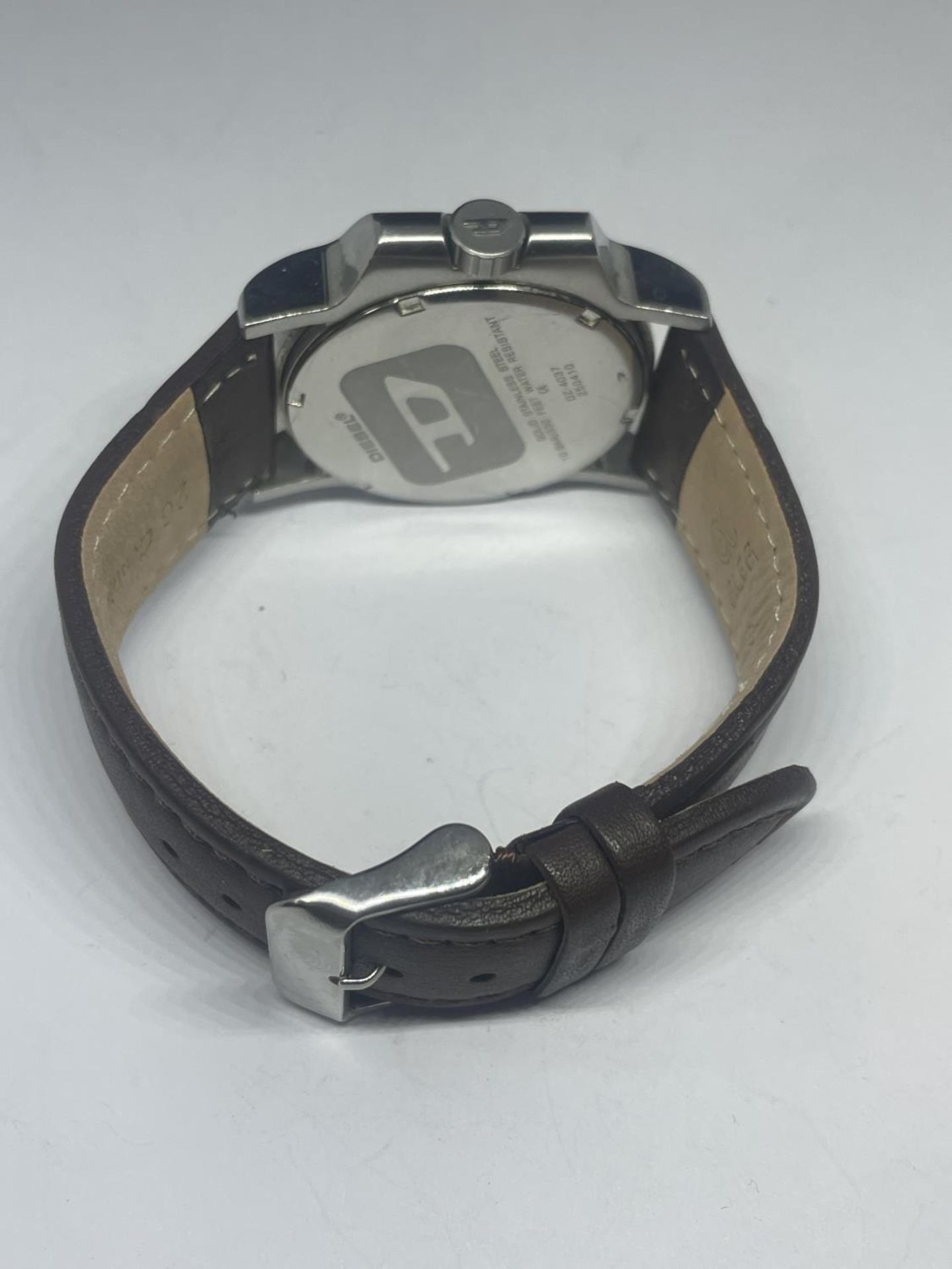 A DIESEL DAY AND DATE WRIST WATCH SEEN WORKING BUT NO WARRANTY - Image 3 of 3