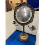 A VINTAGE ADJUSTABLE SHAVING MIRROR WITH CANDLE HOLDERS