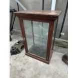 AN EARLY 20TH CENTURY OAK AND GLASS SHOP DISPLAY CABINET
